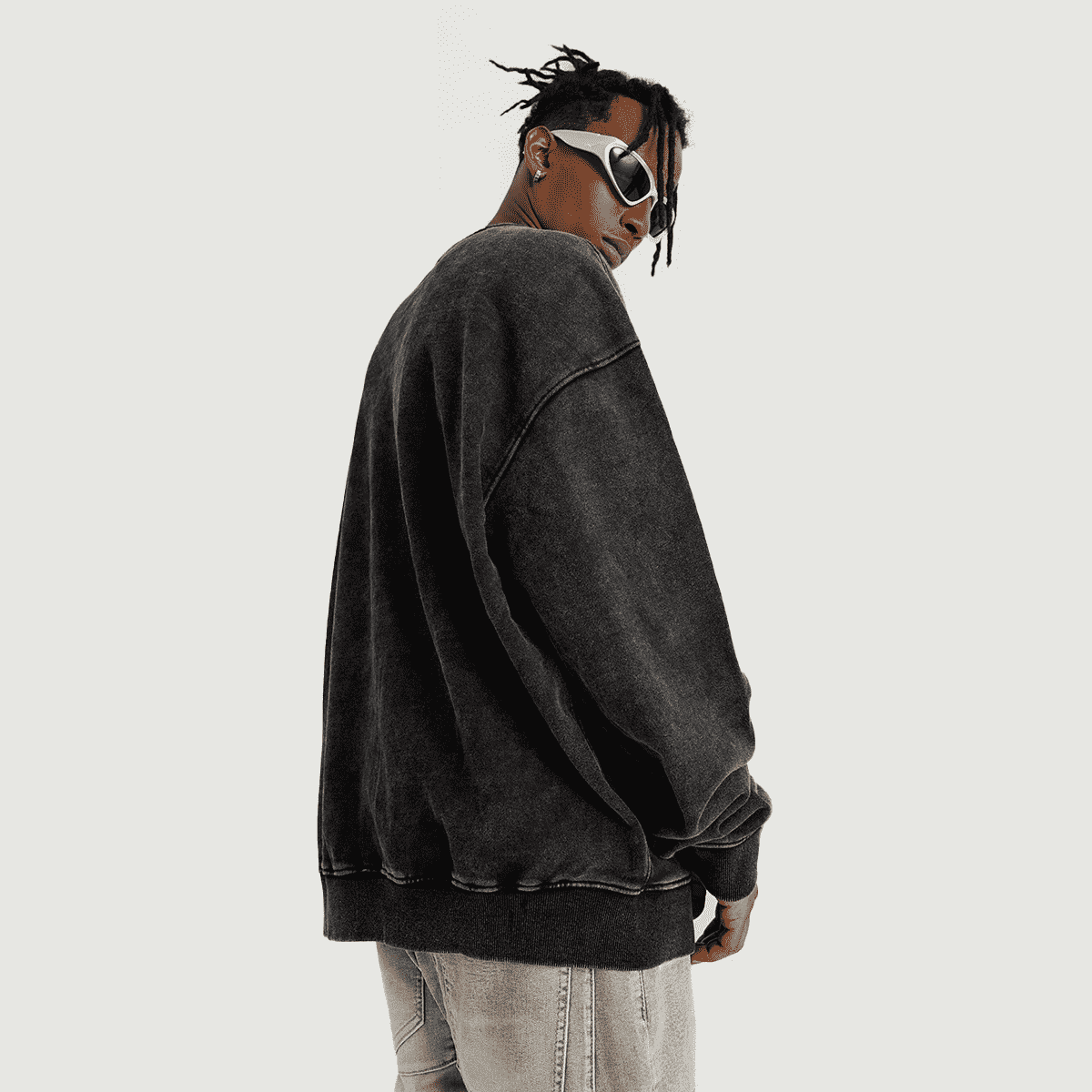 model wearing xtra kitti black oversized sweatshirt and sunglasses 