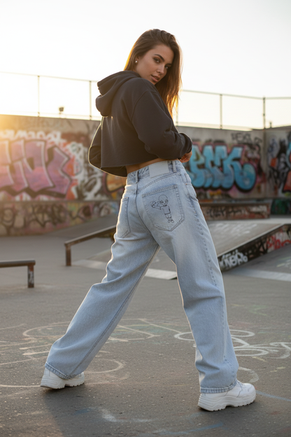 Female model turning right showing xTra on back right pocket at skate park