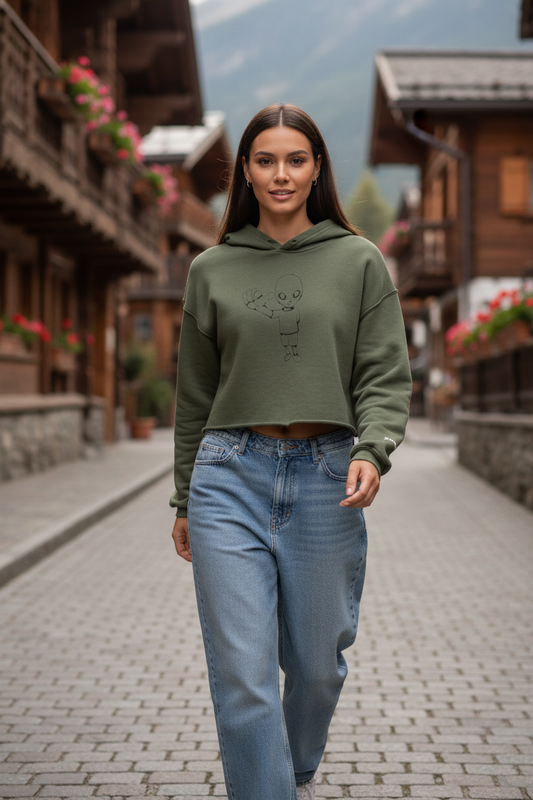 Tight crop of woman in military green xtra crop hoodie in mountain village